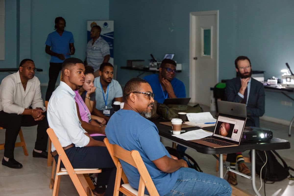 Faculty presenting during a scientific session